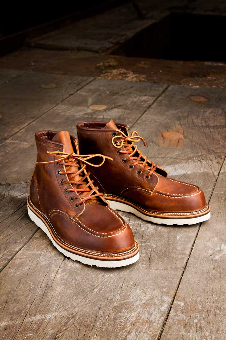 A Pair of brown Boots on a wooden floor